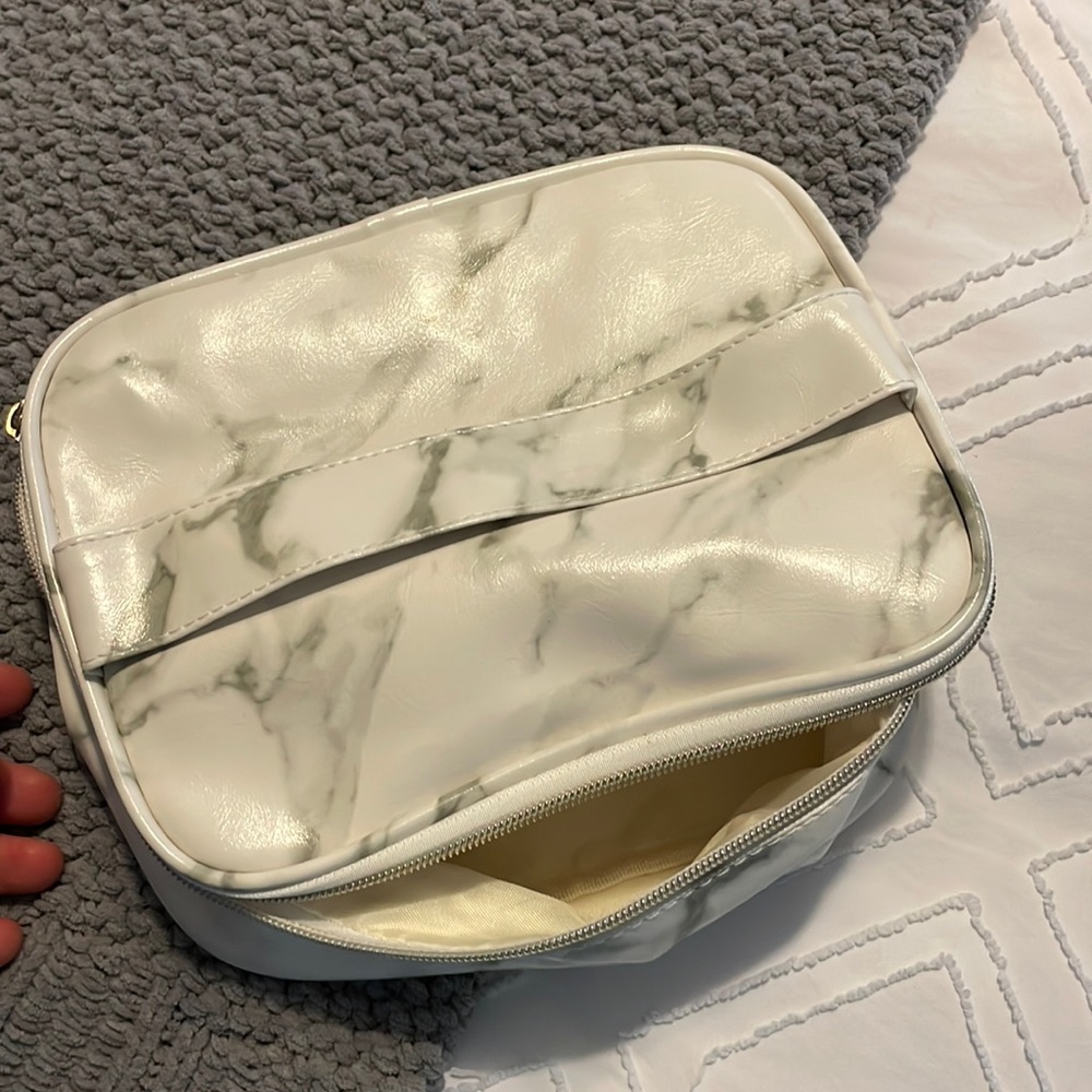 Make up purse ; girlfriend bought but now it’s in. A corner help
